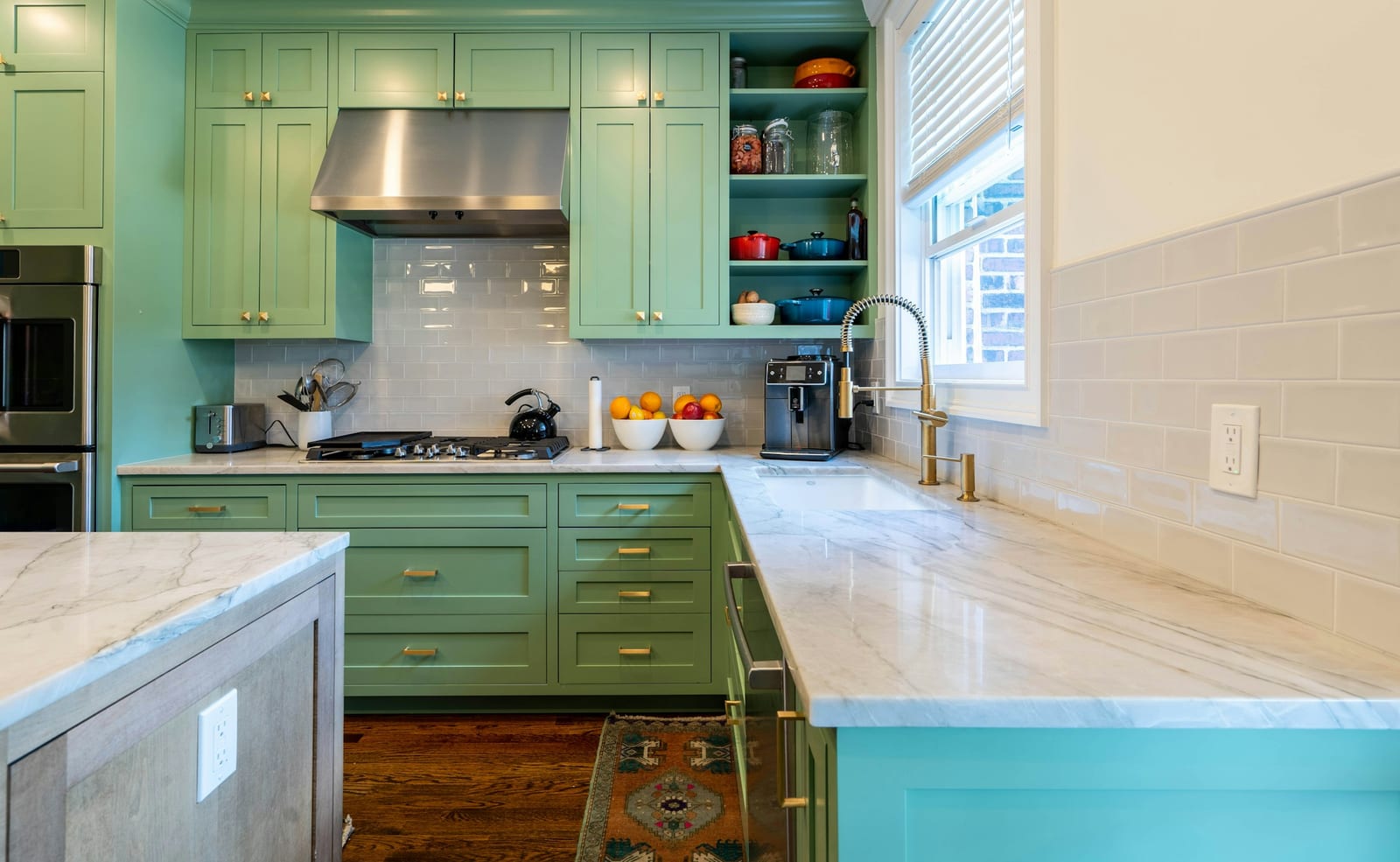 Sage green painted kitchen cabinets in a Garland, TX kitchen.