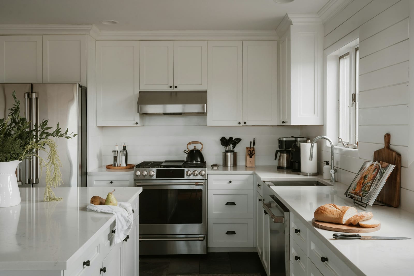 Freshly painted white kitchen cabinets in a Garland, TX home.