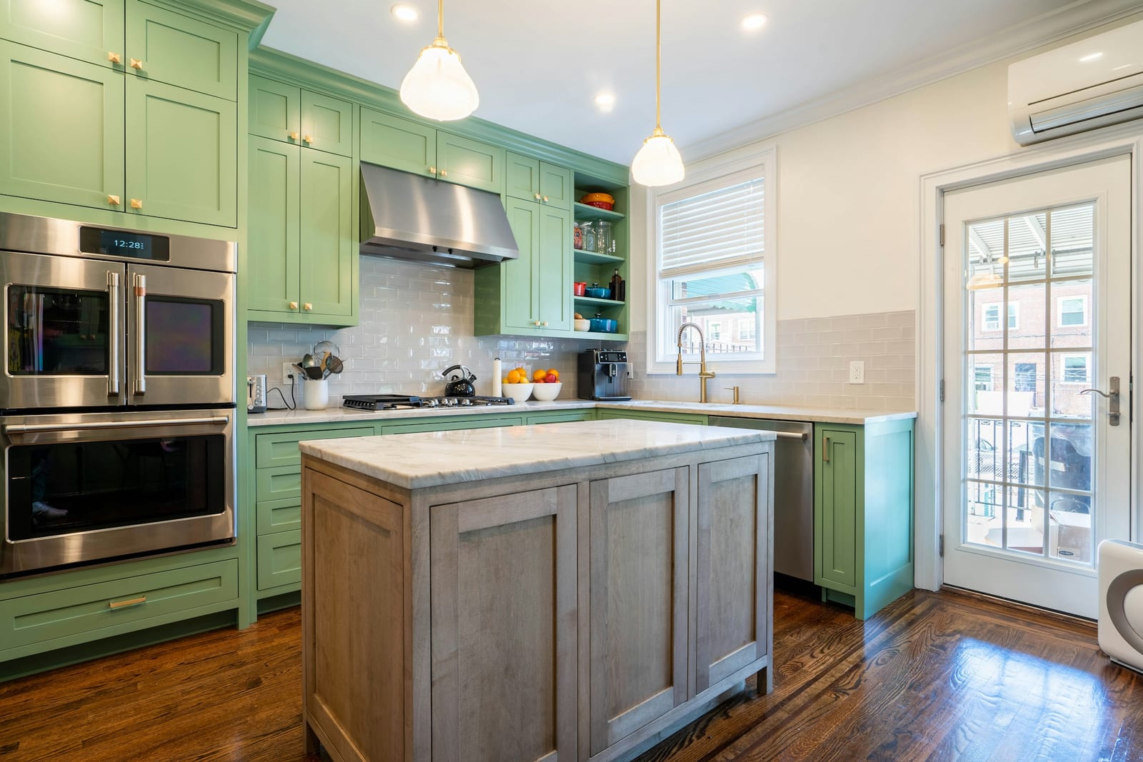 Newly painted green kitchen cabinets in a Garland, TX kitchen.