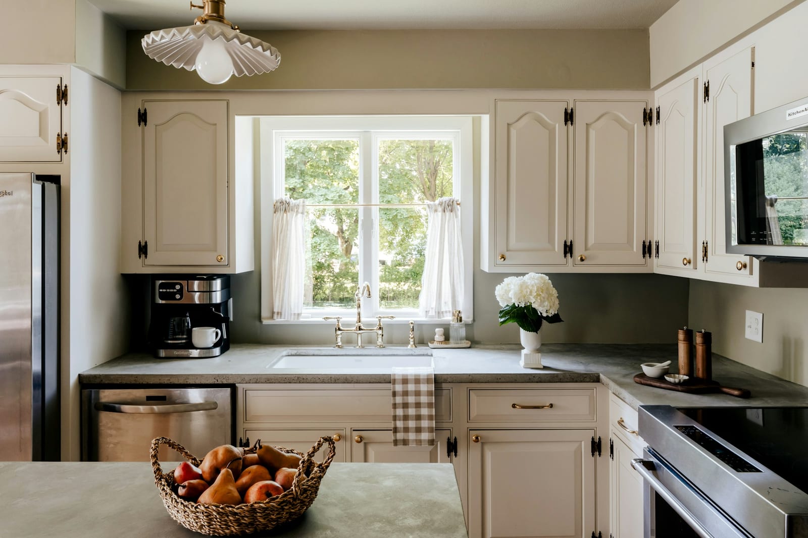 Freshly painted white kitchen cabinets in a Garland, TX kitchen.