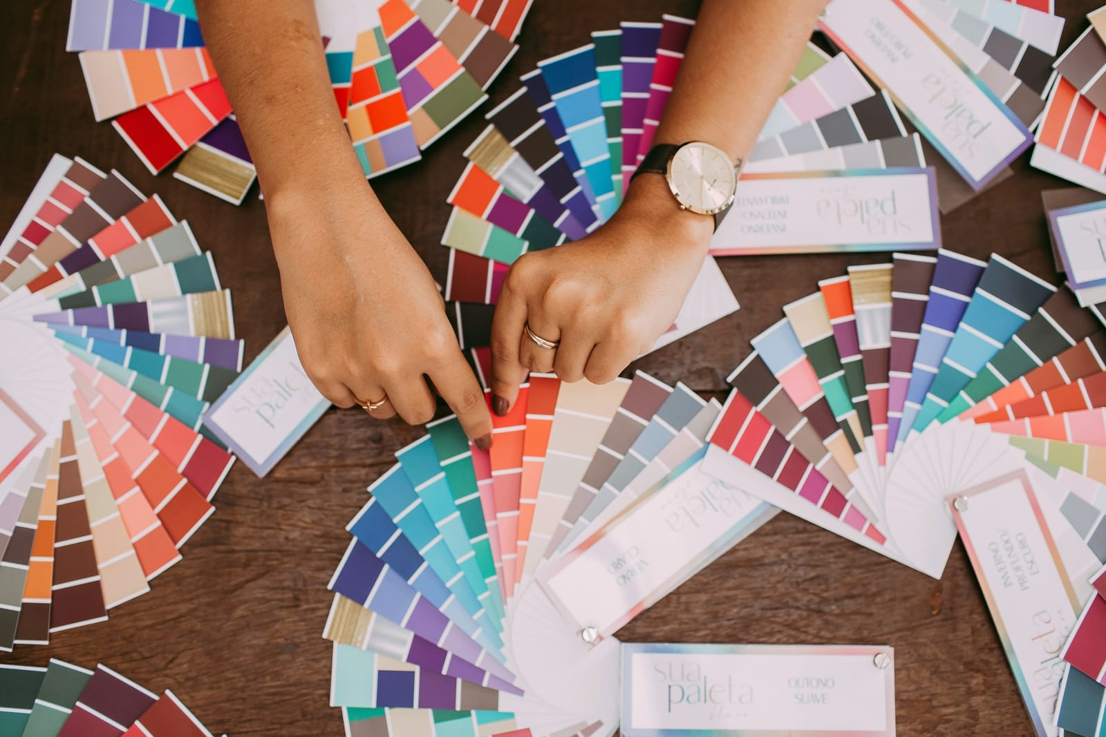 Choosing interior paint colors from swatches for a Garland, TX home.